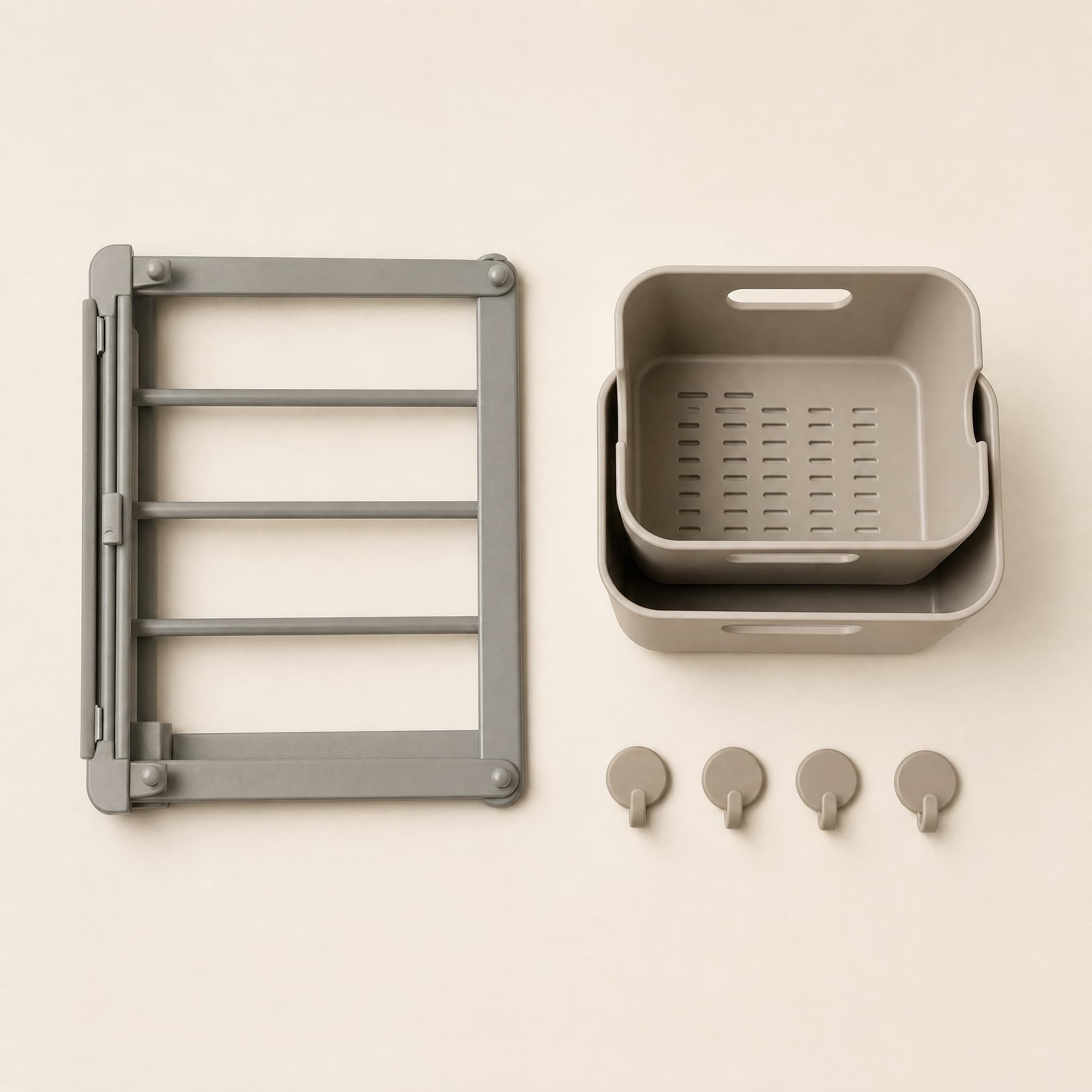 Small-Space Reset Kit flat lay: folded stone-grey steel shelf, two nested stackable bins and four round adhesive hooks.